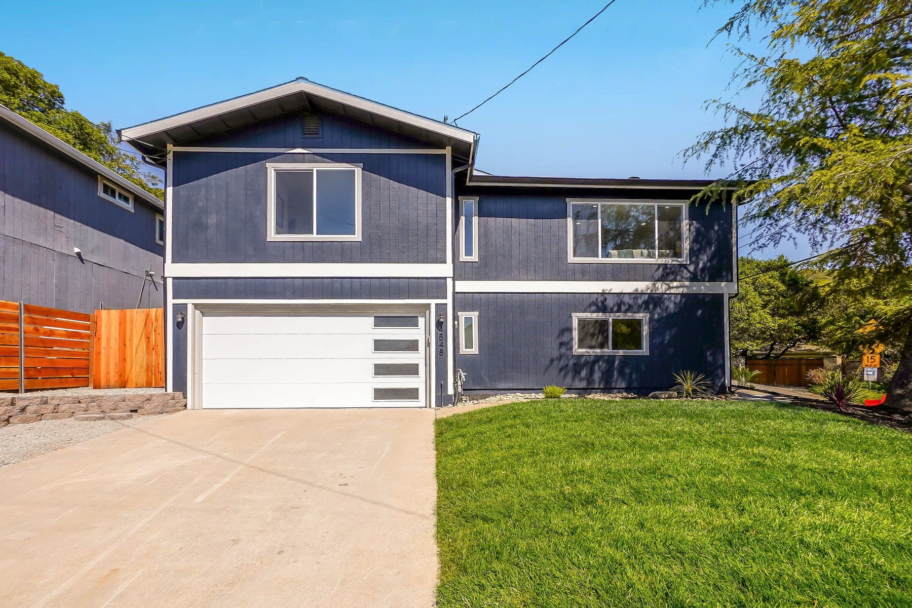 Split-level home before and after a modern exterior renovation — after